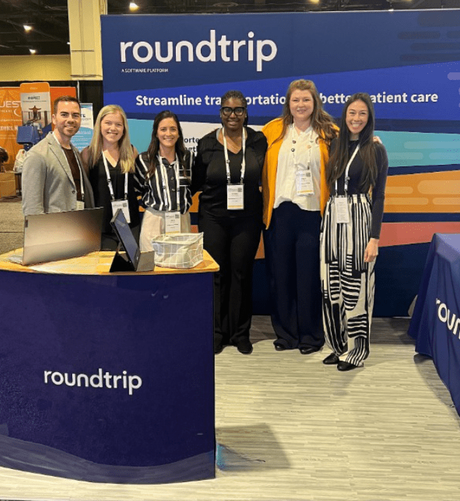 6 Roundtrippers in a trade show booth for the ACMA Conference